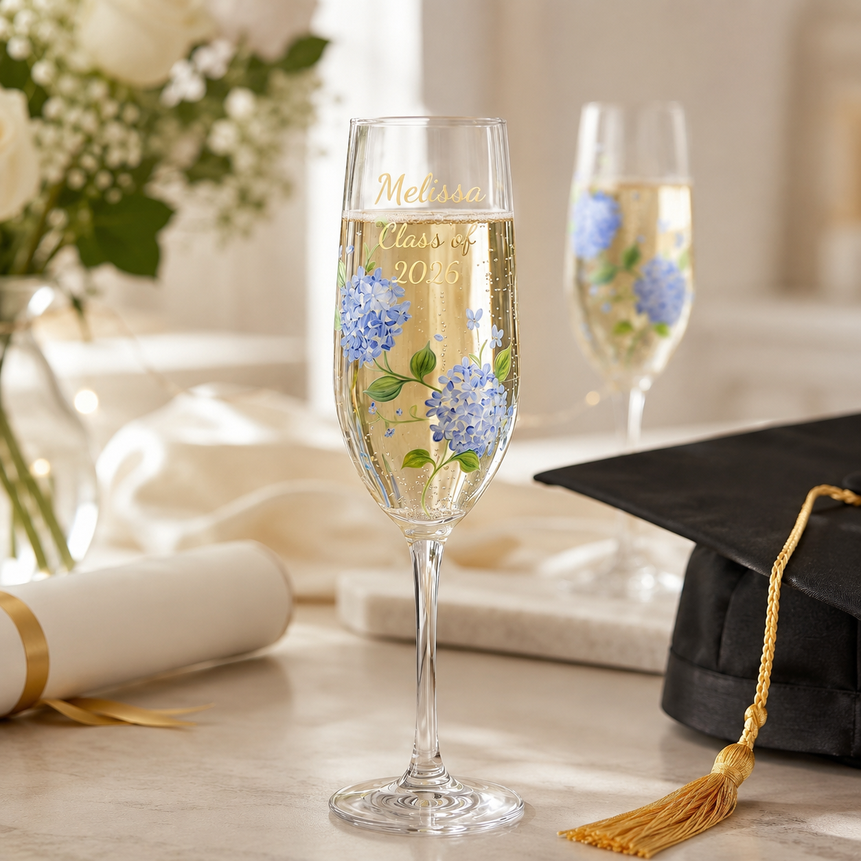 Personalized blue hydrangea champagne flute with Melissa Class of 2026 graduation lettering