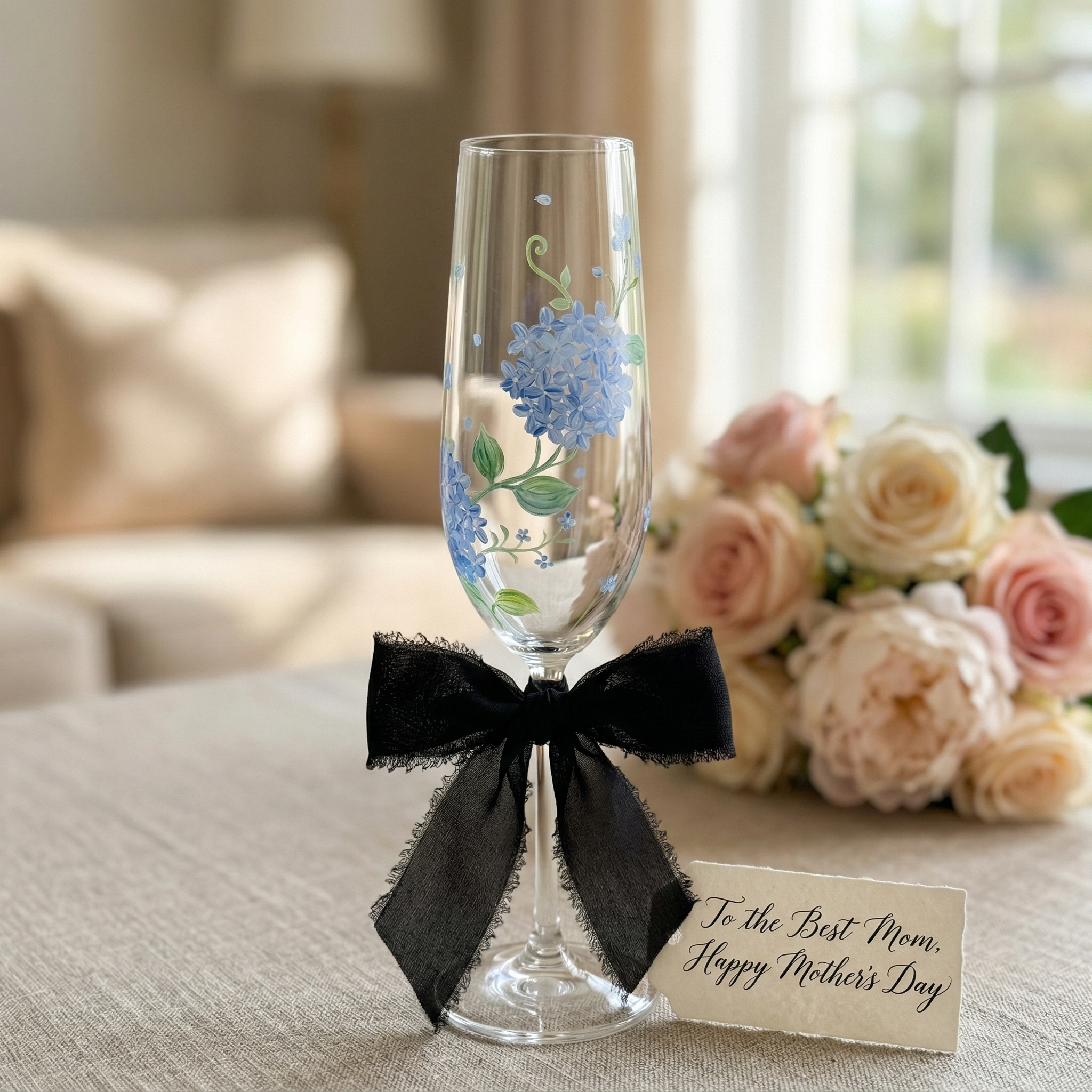 Blue hydrangea hand painted champagne flute styled as a personalized Mother's Day gift