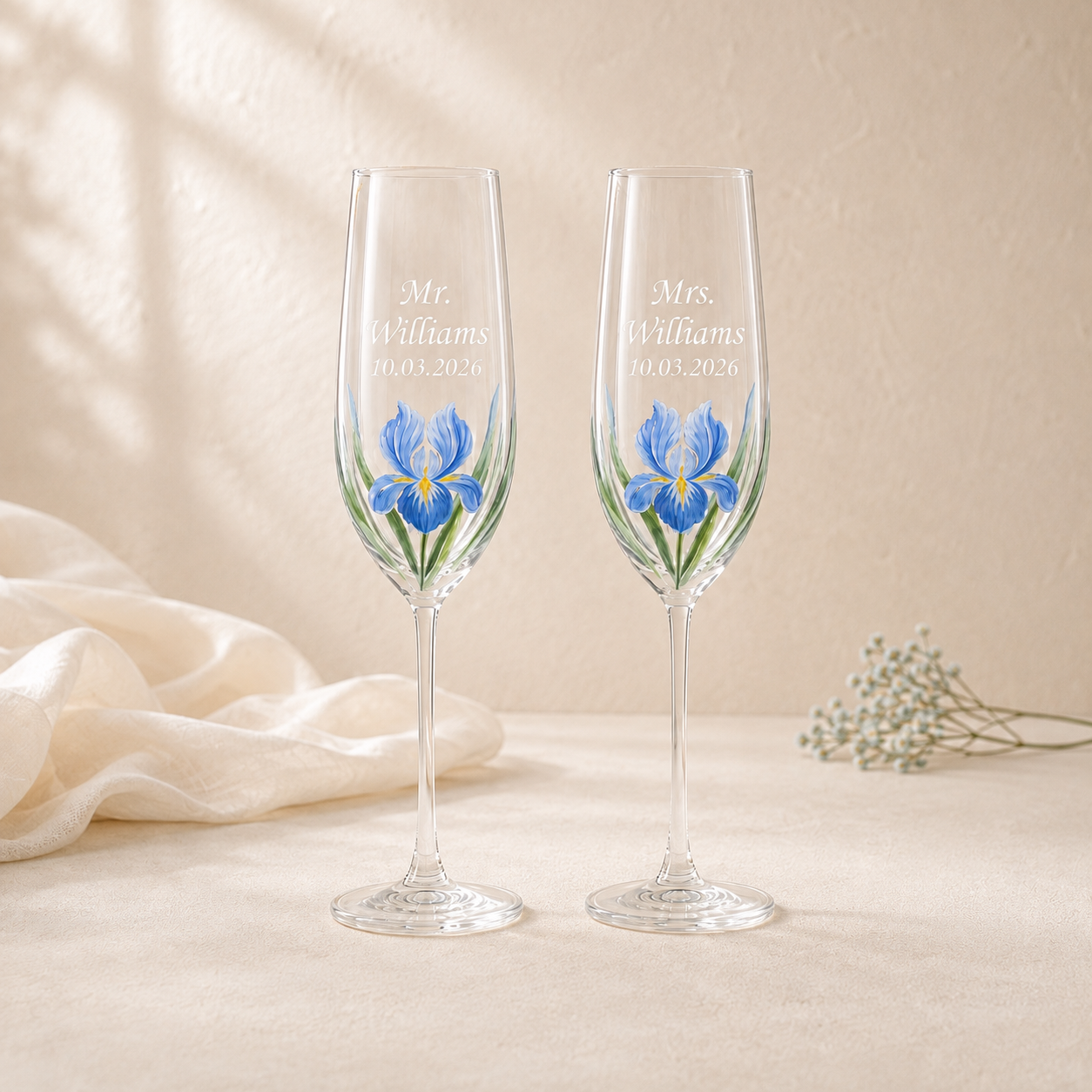 Pair of personalized blue iris champagne flutes with Mr. and Mrs. Williams names and wedding date