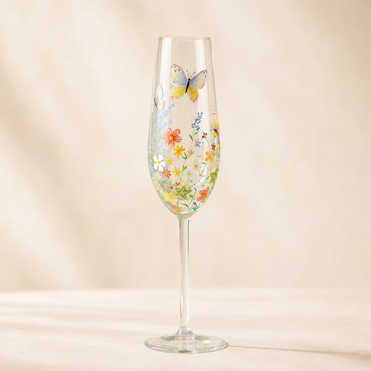 Personalized hand-painted wildflower butterfly champagne flute with colorful floral garden design