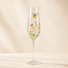 Personalized hand-painted wildflower butterfly champagne flute with colorful floral garden design