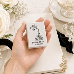 Hand holding personalized handmade ceramic wedding match holder with couple names and date