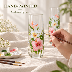 Artist hand painting tropical flowers on glass with hibiscus plumeria and bird of paradise design