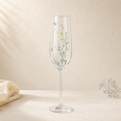 Personalized hand-painted daisy and bee champagne flute with delicate botanical flowers on clear glass